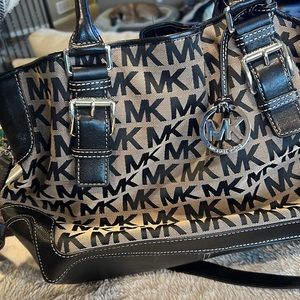 Used Michael Kors bag. Sold as is